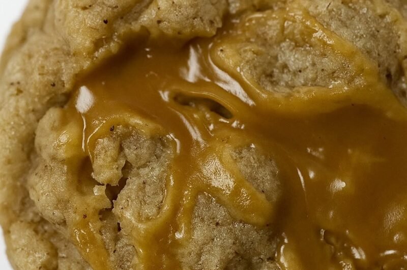 Oatmeal chocolate chip caramel cookie drizzled with caramel sauce